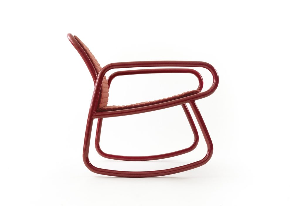a red minimalistic rocking chair